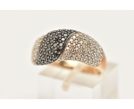 A 9CT GOLD DIAMOND DRESS RING, pave set with colourless single cut diamonds and pave set round brilliant cut black diamonds, 