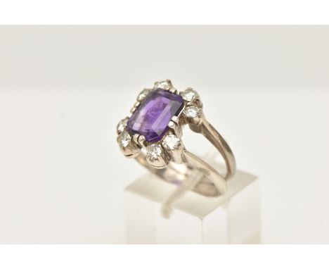 A WHITE METAL AMETHYST AND DIAMOND DRESS RING, set with a rectangular amethyst, measuring approximately 10.14 by 7.92mm (dept