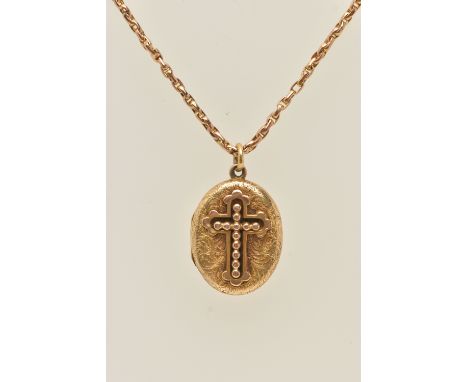 A YELLOW METAL OVAL LOCKET WITH CHAIN, the oval hinged locket displaying a beaded cross to the front and a floral pattern to 