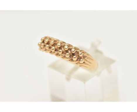 A 9CT YELLOW GOLD KEEPERS RING, hallmarked 9ct gold London 1988, sponsors marks A &amp; Co, ring size U 1/2, approximate gros