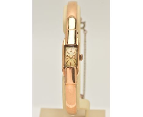 A RETRO REIMAR WRISTWATCH, the rectangular cream dial, with gilt hourly applied markers, plain polished sides enclosing plexi