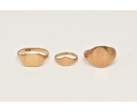 THREE SIGNET RINGS, to include an oval shape signet ring with initial monogram, hallmarked 9ct gold Birmingham 1957, ring siz