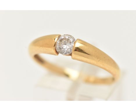 AN 18CT GOLD SINGLE STONE RING, set with a colourless circular cut cubic zirconia, tension set to a polished band, hallmarked