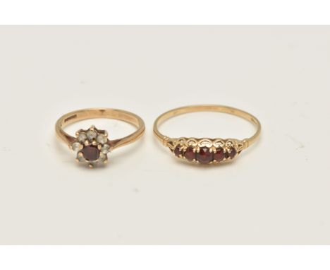 TWO 9CT YELLOW GOLD GARNET DRESS RINGS, to include a garnet five stone ring, together with a garnet and colourless paste clus