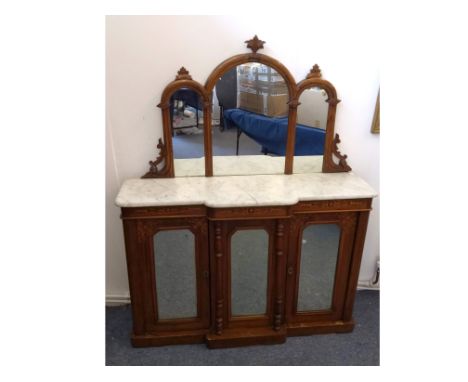 A Victorian walnut and inlaid credenza, marble top with triple arched mirrored back, base with central panel flanked by two p