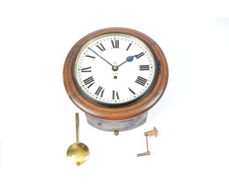 An early 20th Century G.P.O. pendulum wall clock, in a wooden case, the enamel dial with Roman numerals and marked G.P.O and 