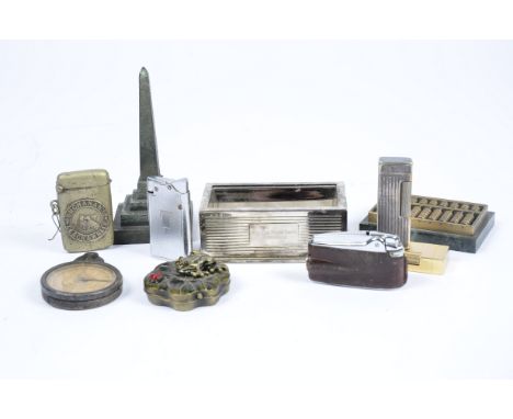 A group of four lighters, including Dunhill 'Rollagas' and Ronson 'Varaflame' examples; together with a Buchanan's Black &amp