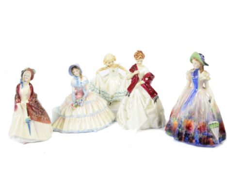 Three Royal Doulton figures, including 'Daydreams' HN1731, 'Paisley Shawl' HN1988 and 'Easter Day' HN2039', with the Royal Wo