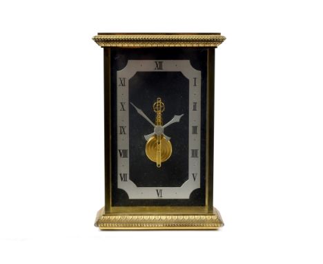 A 20th Century Swiss mantle clock, rectangular steel chapter ring with notched corners, Roman numerals, glazed front and side