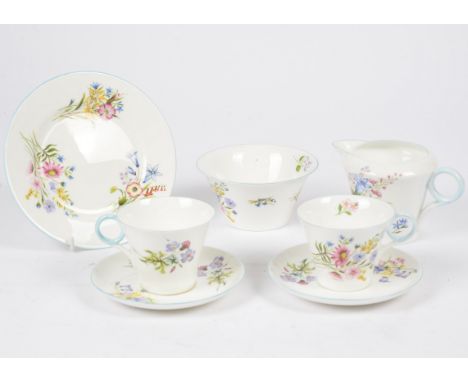 A Shelley porcelain part tea service decorated in the Wild Flowers pattern, no.13668, comprising twelve saucers, nine cups, s