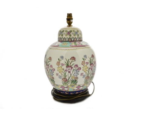 A Chinese famille rose porcelain lamp base, floral decoration, wooden base, 42 cm high including fitting