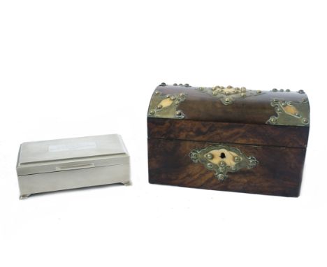 A 20th Century silver cigarette box by the Kemp Brothers, Birmingham 1967, textured finish on raised feet, encasing a rectang