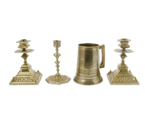 A collection of metalware, including a pair of brass candlesticks, square and octagonal knopped stems, spreading square base,