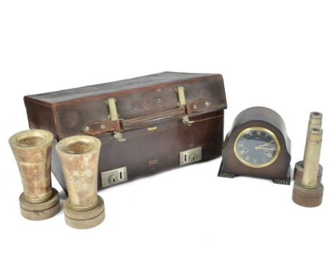 A brown leather suitcase with metal fittings, 50 cm x 35 cm x 16 cm, a Smiths oak mantle clock, 18 cm high, two wooden vases 