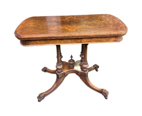 A Late 19th Century Walnut Fold Over Card Table,with hinged and rounded rectangular top on 4 baluster supports on four out sw