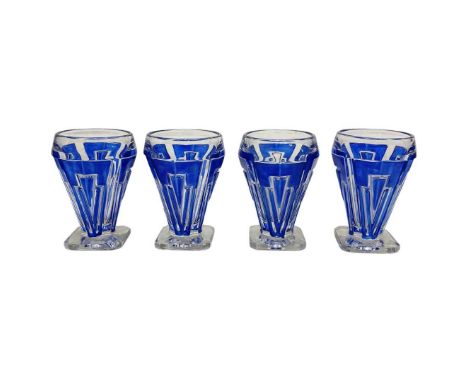 Four Art-Deco Shot Glasses,Clear with blue overlay; and an Art-Deco opaline glass and ashtray, signed A. Hunebelle