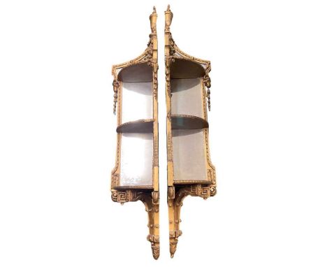 A Pair of Elaborate 19th Century Gilt Mirrored Corner Shelves, each with three tiers and mirror backs, the top urns and ribbo