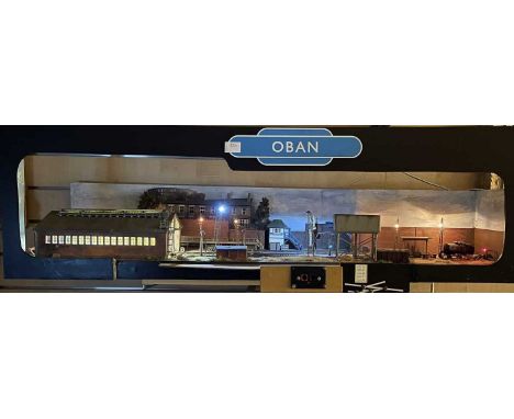 Small Ex-Exhibition OO Scale Complete Railway based on Oban. All wired, lighting works, points, etc not tested.Length 116 x 3