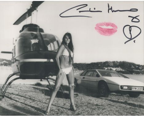 Bond Girl, Caroline Munro signed 10x8 black and white photograph with lipstick kiss. Munro played Bond girl Naomi in The Spy 
