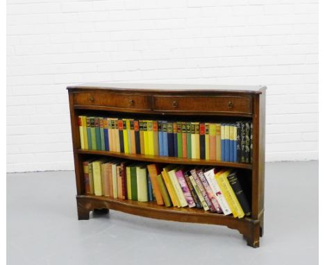 Mahogany bookcase, the serpentine top above pair of frieze drawers and adjustable shelf, on shaped base together with a quant