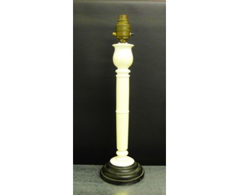 Early 20th century ivory table lamp base, on a stepped black pottery base, 44cm high, including fitting