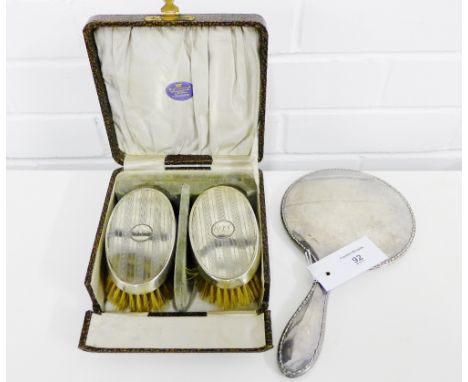 Two George V Art Deco silver backed clothes brushes in original fitted case together with a  Walker & Hall Sheffield silver b