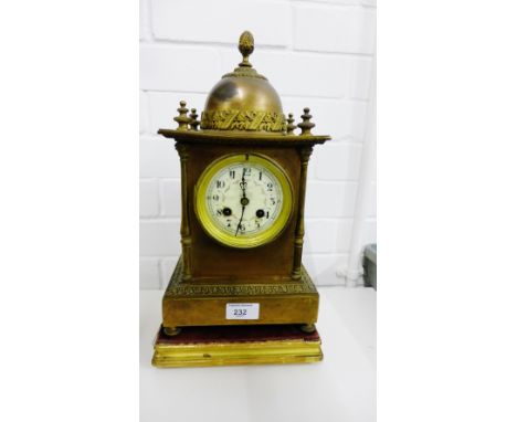 19th century French brass cased mantle clock, with a domed top and acorn finial above the painted enamel dial with Arabic num