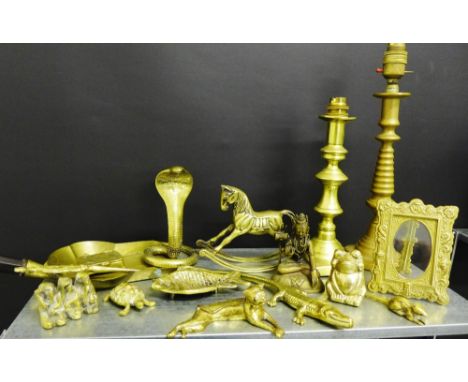Brasswares to include a photograph frame, table lamp bases, a Buddha and a collection of animals etc (a lot)