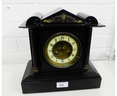 Victorian black slate mantle clock with enamel chapter ring with Arabic numerals, flanked by corinthian columns, on rectangul