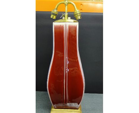 A Sang de Beouf glazed table lamp base, with twin light fitting 