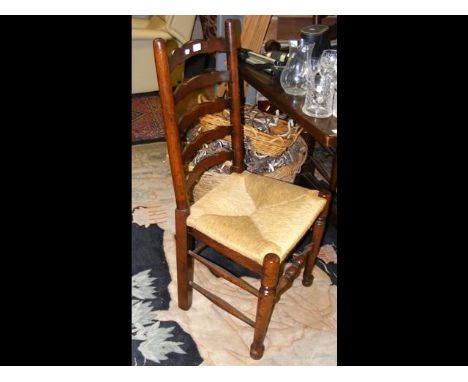 The matching set of eight ladder back dining chairs with rush seats 