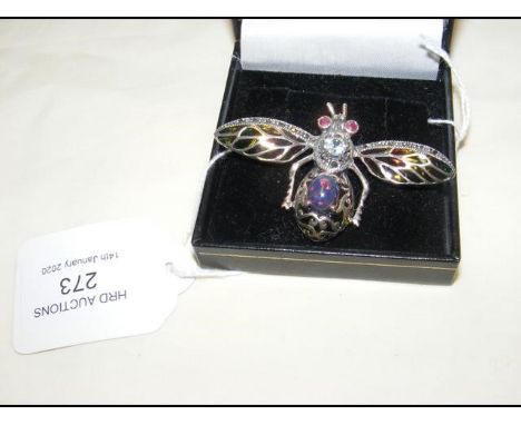 A silver 'moth' brooch set with ruby eyes 
