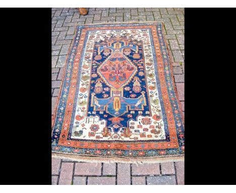 An antique Middle Eastern carpet with geometric border - 180cm x 110cm 