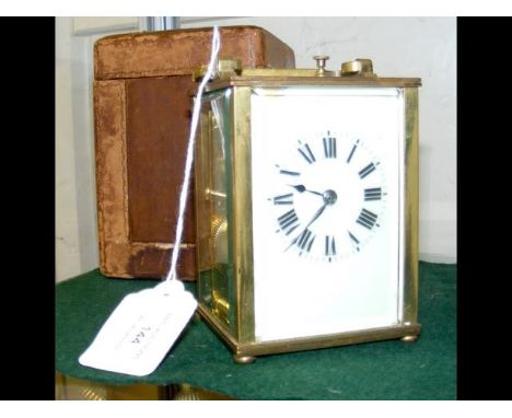 A brass cased repeater carriage clock - 11cm high - with leather carrying case CONDITION REPORT3.5 " glasshas keyneeds a clea
