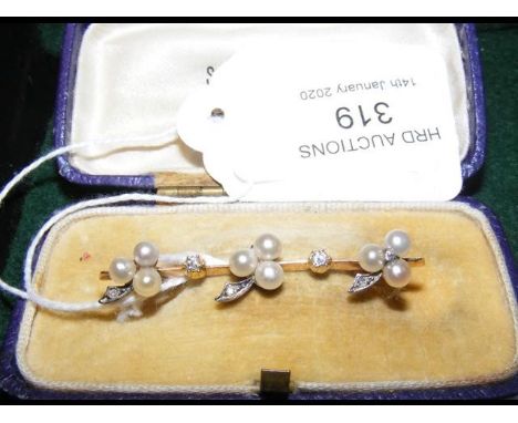A decorative diamond and pearl bar brooch in gold setting  CONDITION REPORTno hallmarks