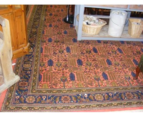 A large Middle Eastern style carpet with geometric border - 13.2ft x 9.8ft CONDITION REPORTas per images