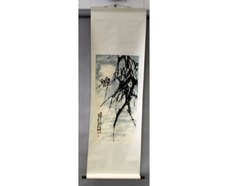 A CHINESE HANGING SCROLL PAINTING ON PAPER, decorated with calligraphy and two birds perched on a branch, the painting itself