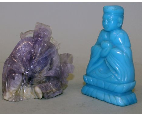 AN EARLY 20TH CENTURY CHINESE AMETHYST CARVING OF A SEATED IMMORTAL, 3.75in wide & 3.5in high; together with a South-East Asi