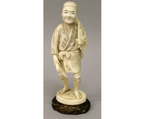 A JAPANESE MEIJI PERIOD IVORY OKIMONO OF A WOODCUTTER, together with a fitted wood stand, the standing man carrying an axe an