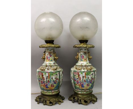 A GOOD LARGE PAIR OF 19TH CENTURY ORMOLU MOUNTED CANTON PORCELAIN VASES, fitted for electricity and with oil lamp fittings in