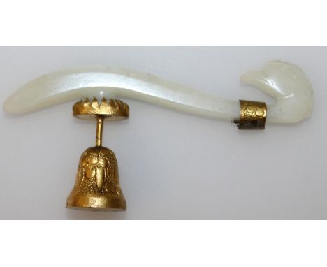 A 19TH/20TH CENTURY CHINESE WHITE JADE BELT HOOK, with gilt-metal mounts, the hook unusually carved in the form of a bird's h