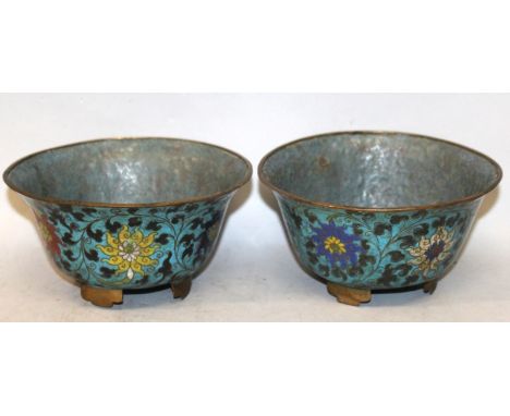 A PAIR OF 19TH CENTURY ORIENTAL MING STYLE CLOISONNE BOWLS, each decorated on a turquoise ground with a formal design of scro