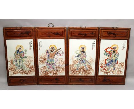 A SET OF FOUR LARGE CHINESE WOOD FRAMED FAMILLE ROSE PORCELAIN PLAQUES, each decorated with calligraphy and a cloud borne Imm