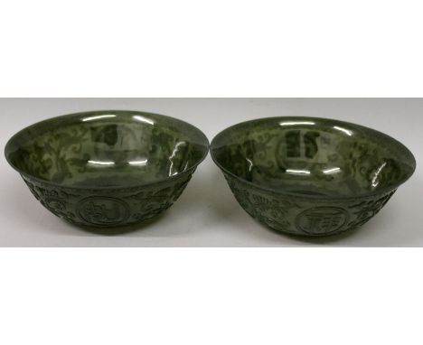 A PAIR OF CHINESE SPINACH GREEN JADE-LIKE BOWLS, each decorated to its sides with formal lotus and auspicious characters, eac