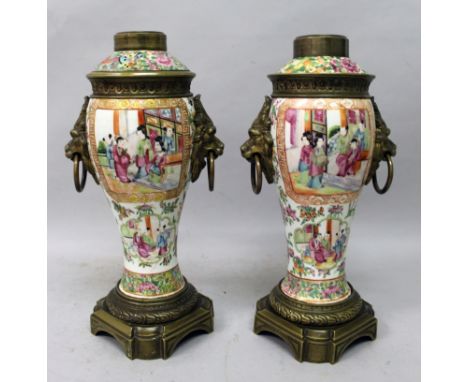 A PAIR OF 19TH CENTURY CHINESE CANTON PORCELAIN VASES & COVERS, with good quality French ormolu fittings, the sides painted w