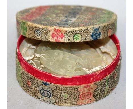 AN EARLY 20TH CENTURY CHINESE JADE PLAQUE NECKLACE, together with a circular printed paper box, the necklace formed from five