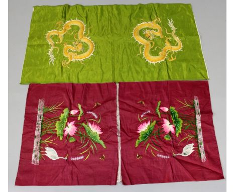 TWO EARLY 20TH CENTURY CHINESE SILK CUSHION COVERS, not sewn, one lime-green ground with dragons, the other ruby ground with 