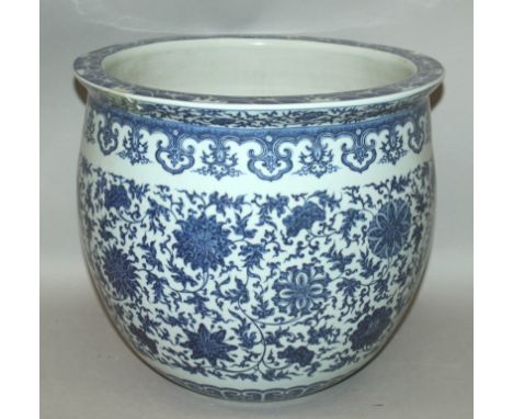 A GOOD LARGE CHINESE MING STYLE BLUE & WHITE PORCELAIN JARDINIERE, the sides decorated between formal borders with a wide for