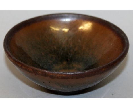 A CHINESE SONG STYLE HARE'S FUR CERAMIC TEABOWL, the glaze on the exterior falling short of the foot, 3.7in diameter at rim &
