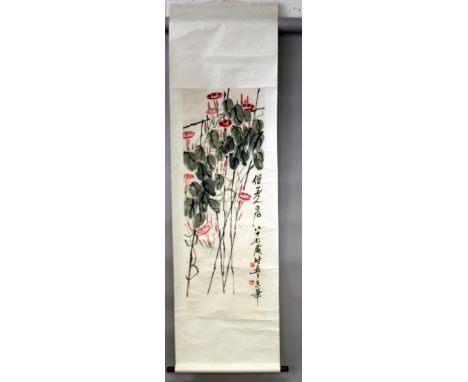 ANOTHER CHINESE HANGING SCROLL PAINTING ON PAPER IN THE MANNER OF QI BAISHI, decorated with calligraphy, flowers and leafage,